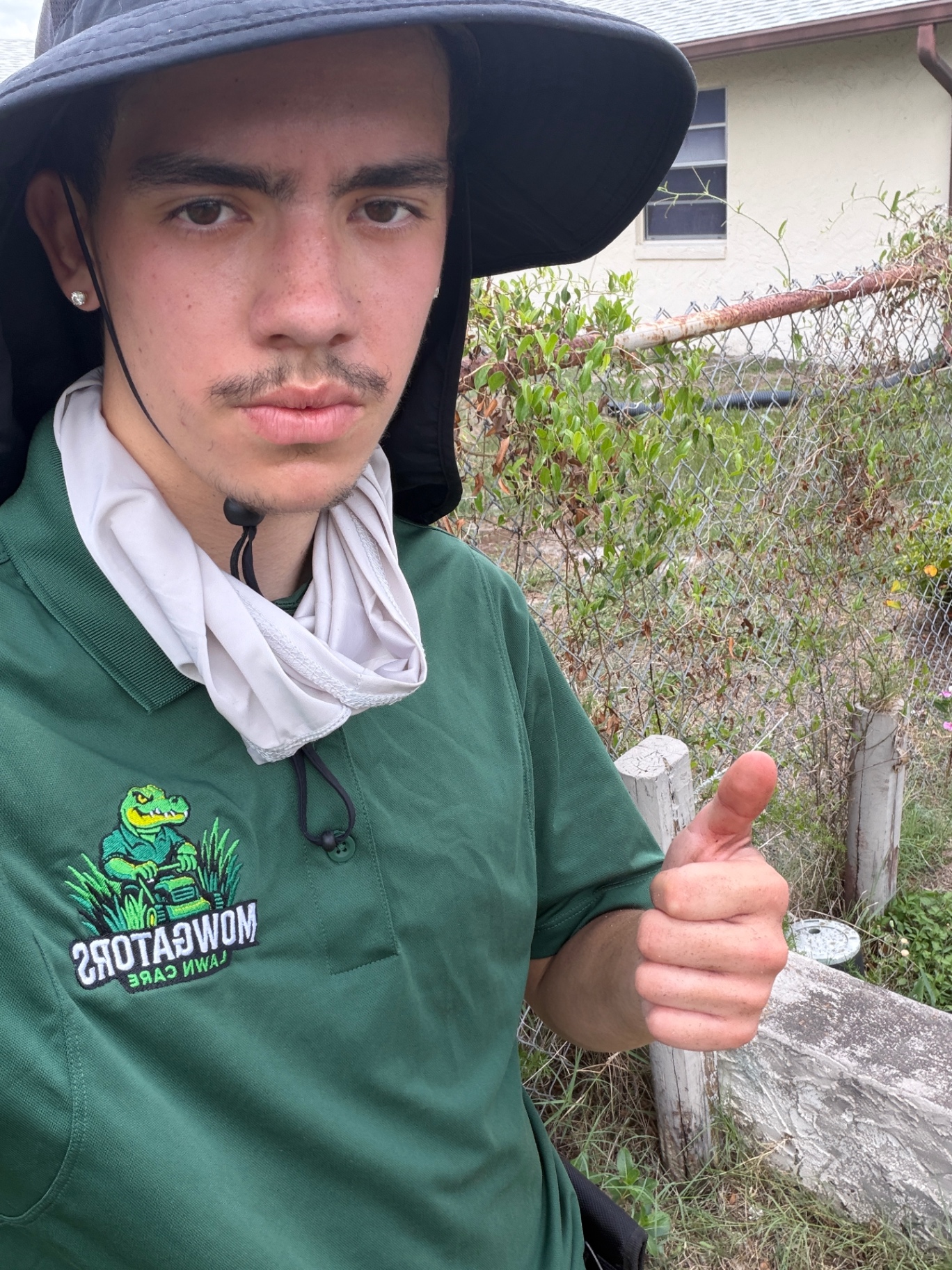 Legend Ramos, Founder of Gator Home Services, in Mow Gators uniform